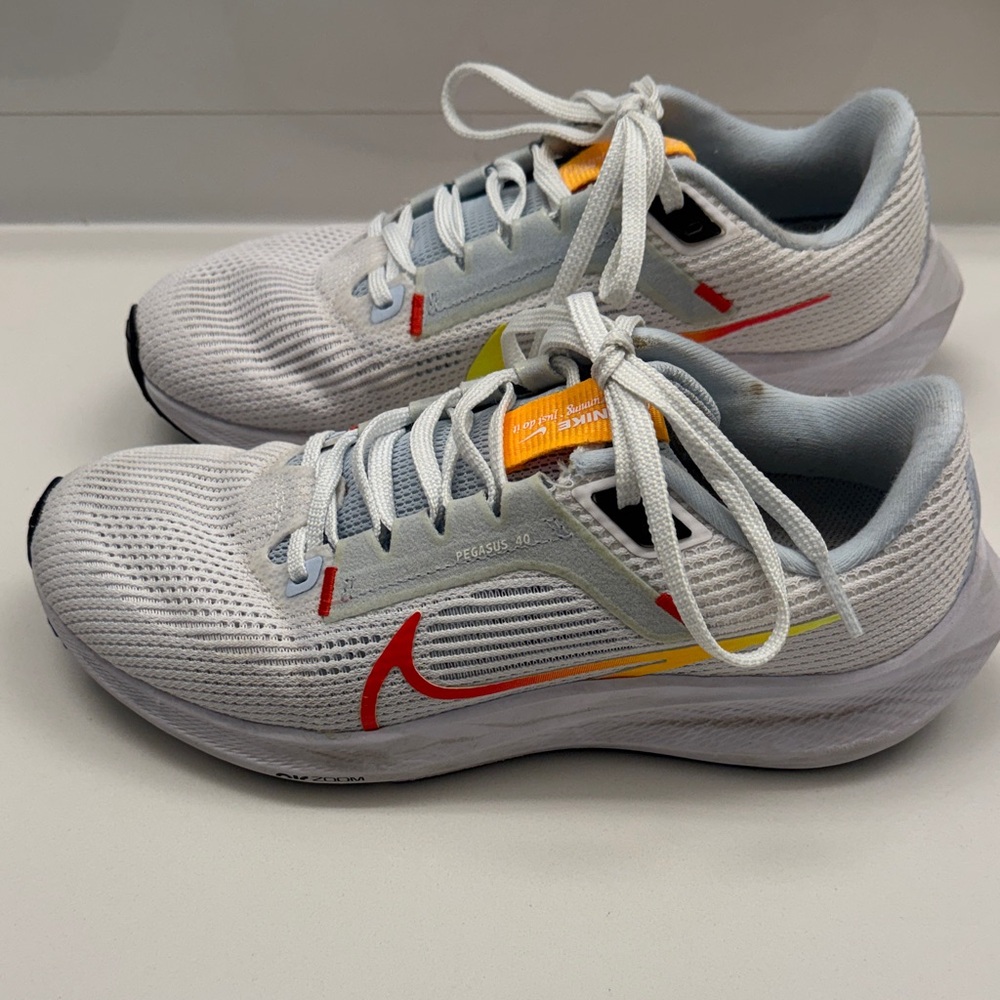 Nike White Sneakers with Red and Yellow Accents